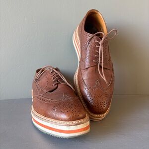 Prada Men's Brown Leather Wingtip Shoes with Striped Platform Sole